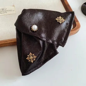 Elegant dark brown triangular fabric hair claw clip with pearl and vintage gold filigree