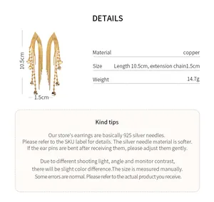 Detailed view of gold plated tassel earrings with material and dimension specifications.