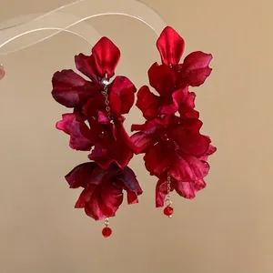 Elegant red fabric flower drop earrings with golden tassel and bead details for summer vacation