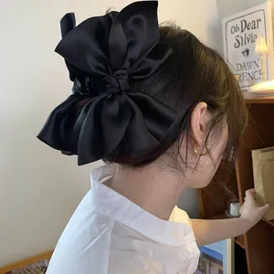 Elegante molletta per capelli in raso nero con fiocco per chignon da donna chic