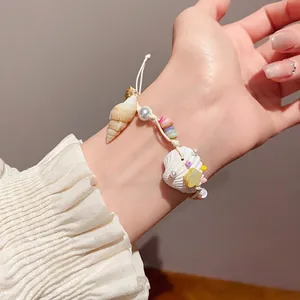 Handmade beach-style seashell and pearl charm bracelet with colorful ceramic beads for women