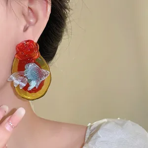 Vintage resin koi fish and red rose stud earrings in New Chinese style.