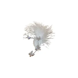 Elegant rhinestone butterfly ear cuff featuring soft white feathers and delicate pearls