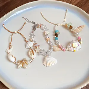 Detailed view of beach-themed bracelets with natural stones and seashells