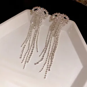 Elegant silver needle zircon bow tassel earrings with long sparkling fringes