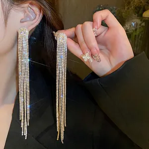Elegant silver needle tassel earrings with sparkling oval zirconia crystals for women
