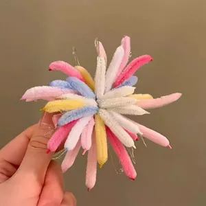 Detailed view of a unique colorful plush petal hair clip with soft chenille texture