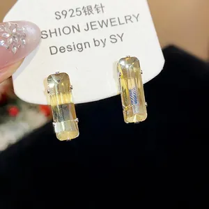 Macro detail of champagne rectangular zircon stud earrings with S925 silver needles