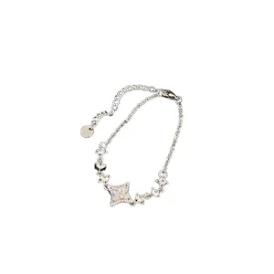 Exquisite silver necklace with sparkling star shaped pendants and zircons on white
