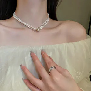 Elegant French vintage multi-layer pearl necklace with a sparkling rhinestone pendant
