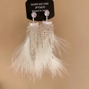 Silver needle earrings with zircon and white feather tassel in elegant vintage style