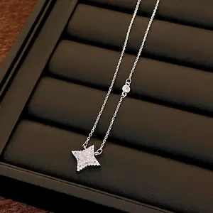 Elegant silver-tone necklace with a radiant star-shaped pendant and cubic zirconia.