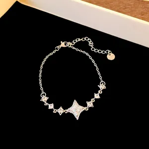 Close-up of elegant stainless steel bracelet with sparkling star zircon pendants