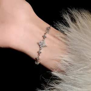 Close-up of an elegant silver star bracelet decorated with shimmering clear zircon stones