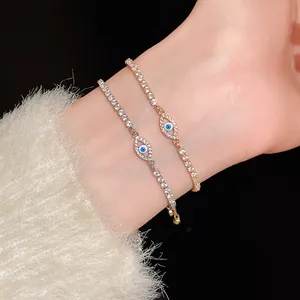 Close-up of two elegant evil eye bracelets with cubic zirconia on a model's wrist
