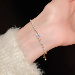 Close-up of sparkling cubic zirconia evil eye adjustable bracelet on a female wrist