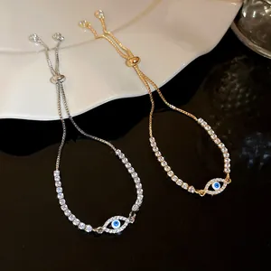 Detail of adjustable tennis bracelets featuring sparkling zircon and Evil Eye motif.