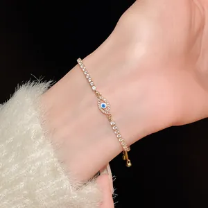 Detailed view of a sparkling cubic zirconia oval evil eye adjustable bracelet on model