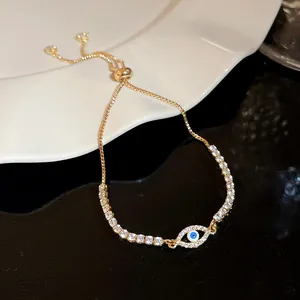 Sparkling zircon evil eye bracelet featuring an adjustable gold-toned box chain detail