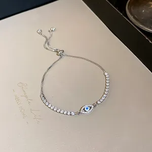 Close-up of evil eye charm bracelet with sparkling cubic zirconia and adjustable slider