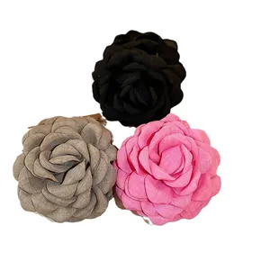 Elegant fabric flower hair clips in pink, black, and khaki for sweet and versatile styling.