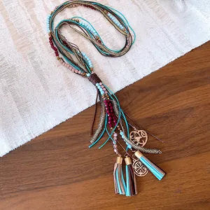 Handmade bohemian multi-layer necklace with turquoise beads, tassels and heart pendant