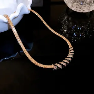 Elegant gold-plated black enamel necklace with sparkling rhinestones in vintage style.