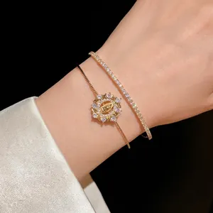 Elegante conjunto de pulsera de oro de doble capa con circonitas cúbicas brillantes