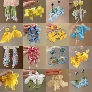 Collection of colorful floral fabric earrings in Mori style for summer beach holidays.