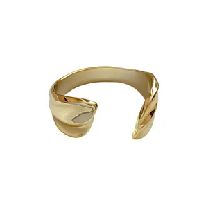 Glossy gold pleated geometric open cuff bracelet with irregular wavy design for women
