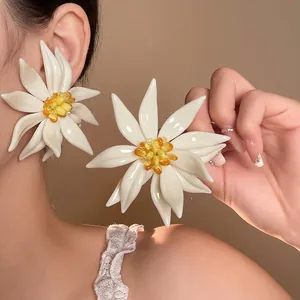 Exaggerated white flower earrings with silver needles for summer beach vacations