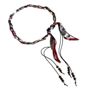 Bohemian silk scarf braided waist chain with elegant wooden bead accents on white background