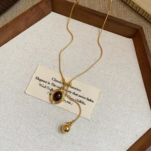 Vintage Maillard oval resin pendant necklace featuring an adjustable gold chain