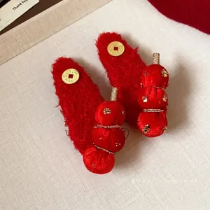 Festive red flocked sugar gourd hair clips with Chinese coin detail for New Year