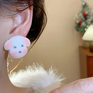 Close-up visual of cute plush puppy dog stud earrings for women worn on the ear