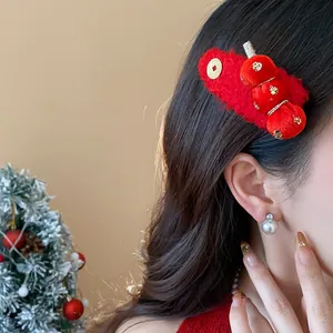 Detailed close-up of a festive red flocked tanghulu hair clip worn by an Asian model