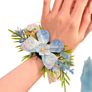 Elegant light blue fabric floral wrist corsage with lace band for wedding and prom