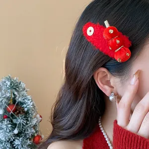 Detail view of festive red flocked hair clip with traditional Chinese tanghulu design