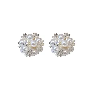 Elegant silver-toned flower cluster stud earrings with pearls and sparkling zircons