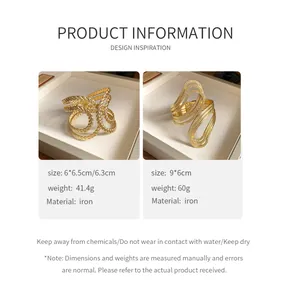 Detail view of gold irregular textured cuff bangles with product specifications