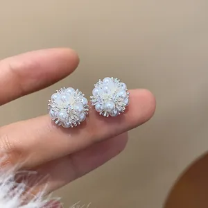 Detailed macro view of silver needle zircon flower cluster stud earrings for elegant women
