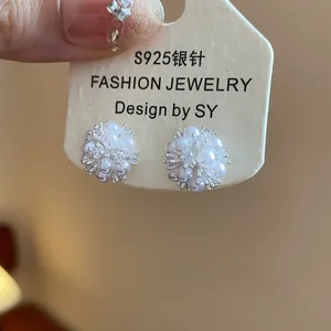 Detailed view of elegant flower cluster stud earrings with zircons and s925 silver needle