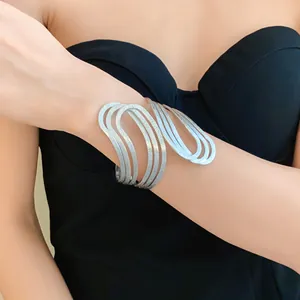 Close-up detail of a silver geometric irregular hollow textured open cuff bracelet