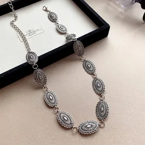 Vintage ethnic silver metal waist chain with carved oval medallions for Y2K style
