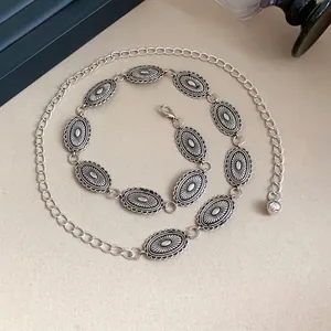 Elegant vintage ethnic silver metal waist chain with oval carved plates for women's fashion