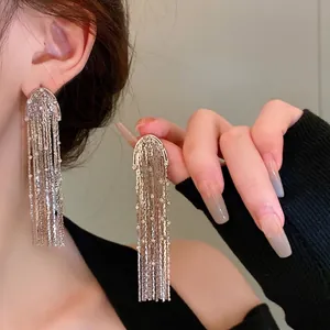 Elegant long metallic tassel earrings with crystal-studded arch for women fashion accessory