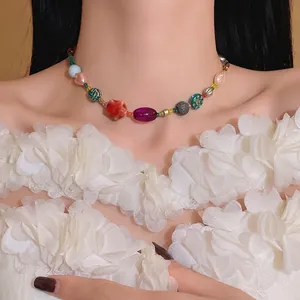 Colorful dopamine-style beaded necklace with ceramic and glass beads worn by model