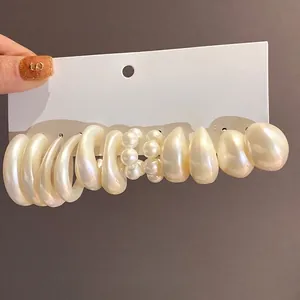 Acrylic geometric waterdrop earring set with pearlescent finish on white card