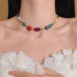 Detailed macro view of a colorful dopamine beaded necklace worn on a model's neck.