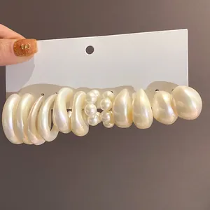 Elegant pearlescent acrylic geometric earring set in creamy white finish for women